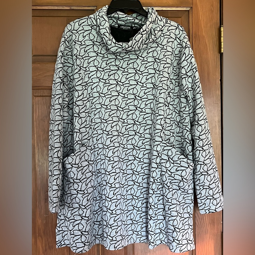 Gray and Black Patterned Top Medium Brand New. Two front pockets cowl neck